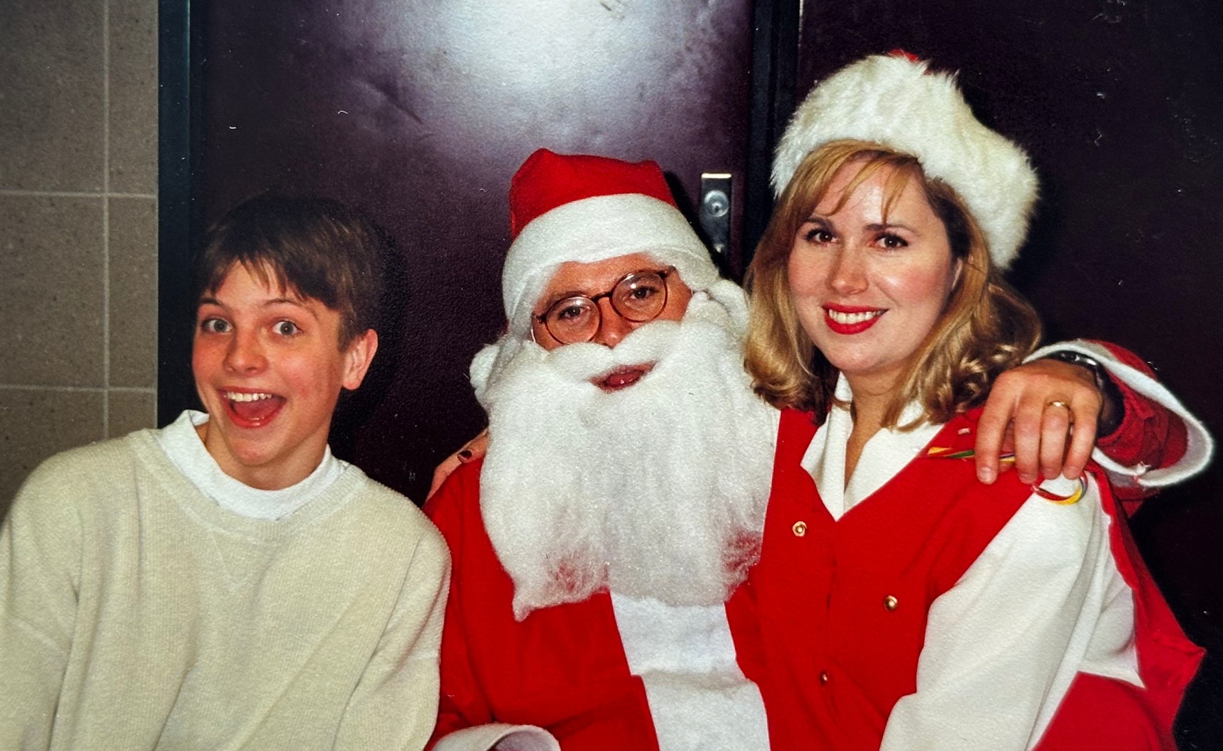 Mankato West High School student Jacob Reitan, who founded the school’s first gay-straight alliance, is pictured with the group’s faculty adviser Tim Walz, dressed as Santa Claus, and his wife Gwen Walz.